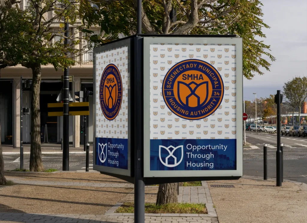 SMHA street kiosk with the new seal and the line Opportunity Through Housing